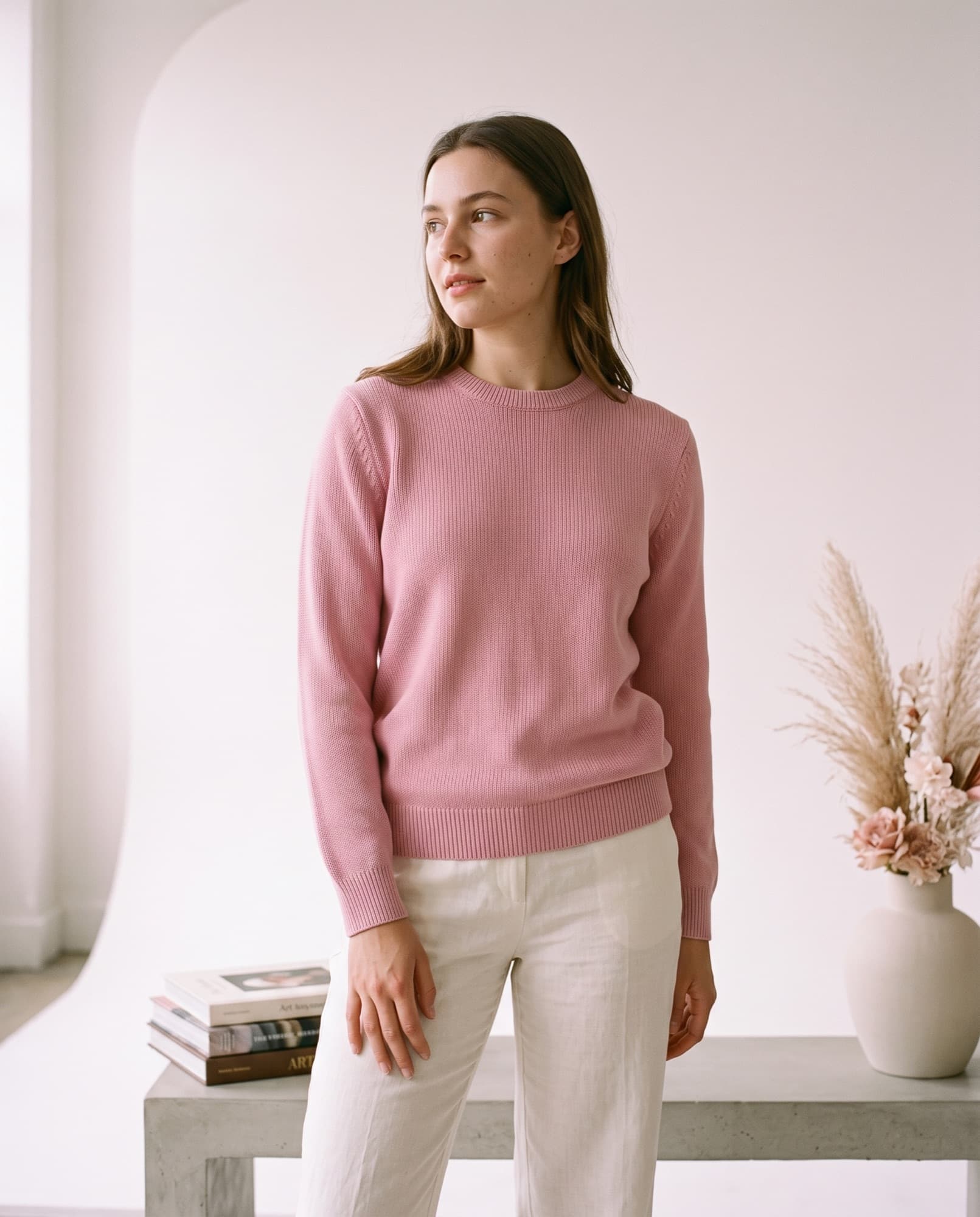 A sweater laid out and shot on a phone at home, and the same sweater on a model